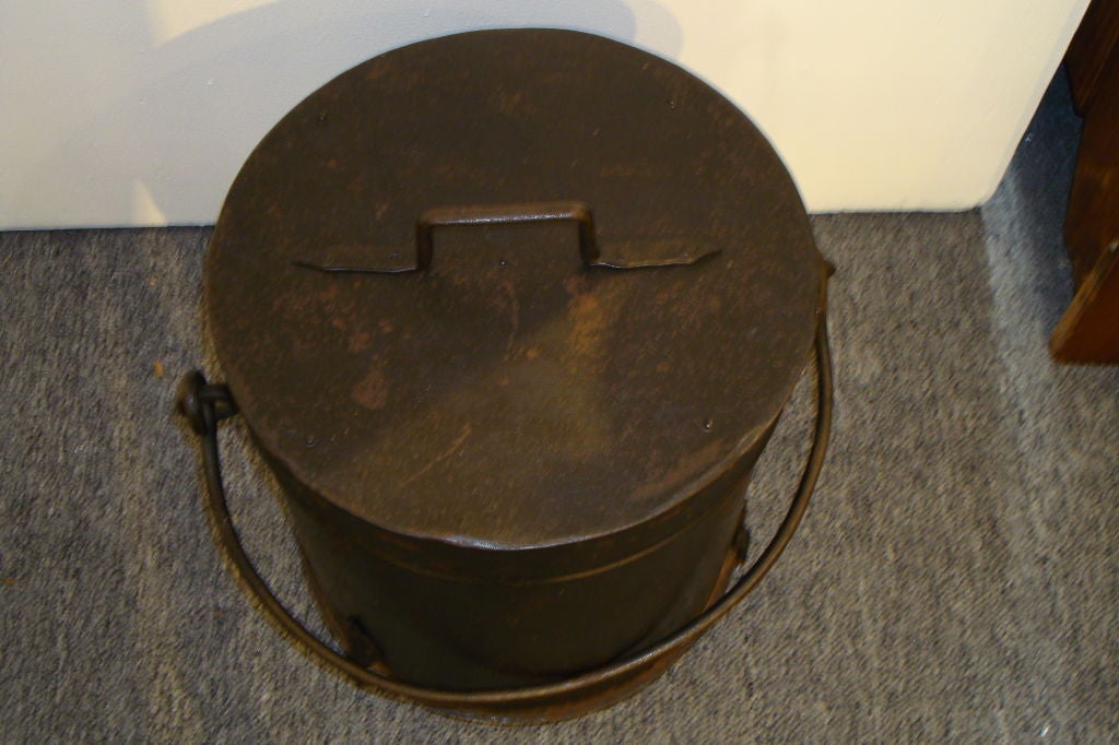 19THC HAND MADE AND HAND FORGED COAL BUCKET FROM PENNSYLVANIA IN ORIGINAL BLACK PAINTED SURFACE. THIS BUCKET W/LID AND HANDLE IS IN GREAT CONDITION AND SURFACE.