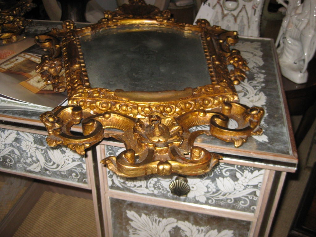 pair of Italian mirrors with reverse etched figures and giltwood frames....these are larger than the usual size
