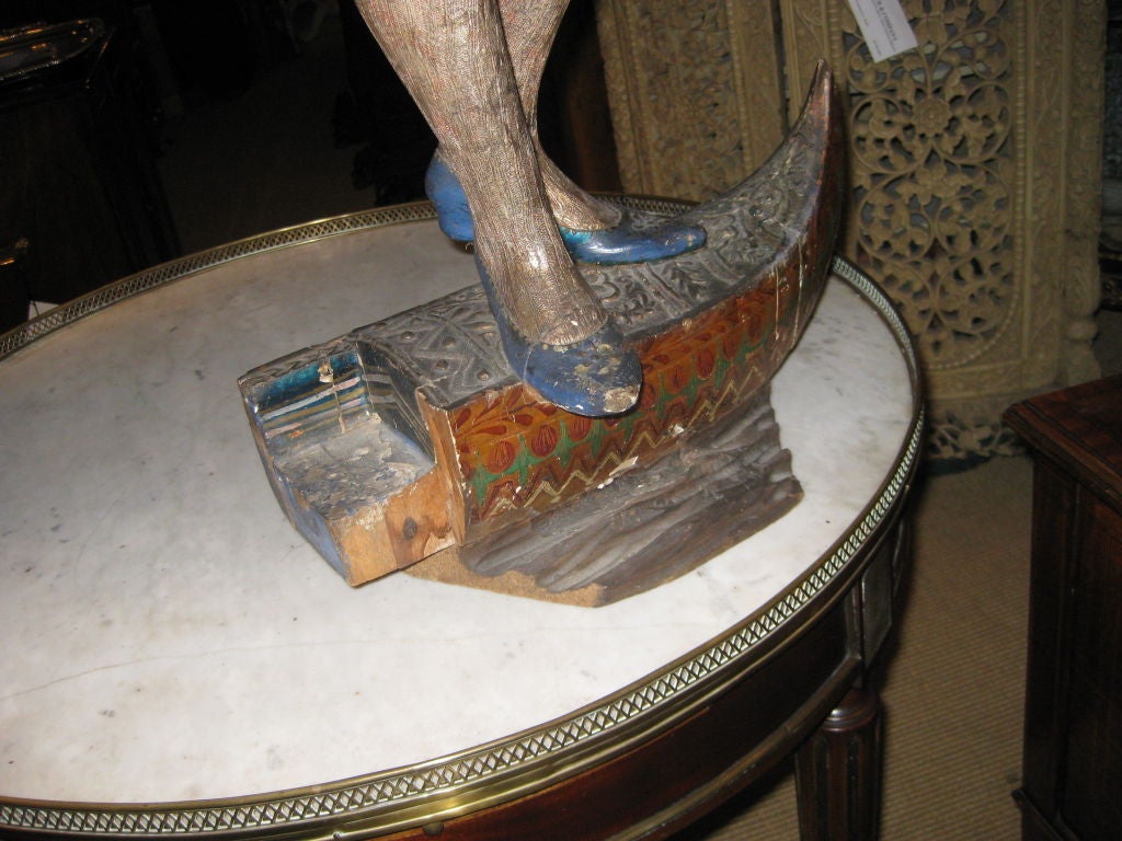 Highly decorative single blackamoor or nubian figure on gondola-this is in as is condition --a chunk is out of the base and most of the paint is original but some restorations to the arm