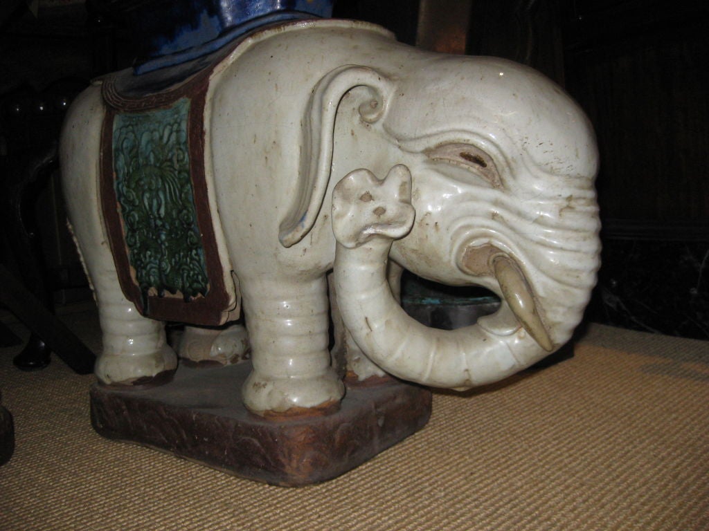 Great looking old pair of asian elephant garden stools --on is in as is conditon with a restored trunk.