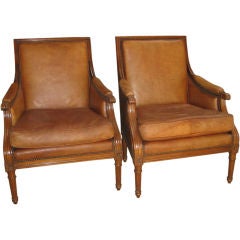 Pair of French Walnut Arm Chairs In Worn Leather