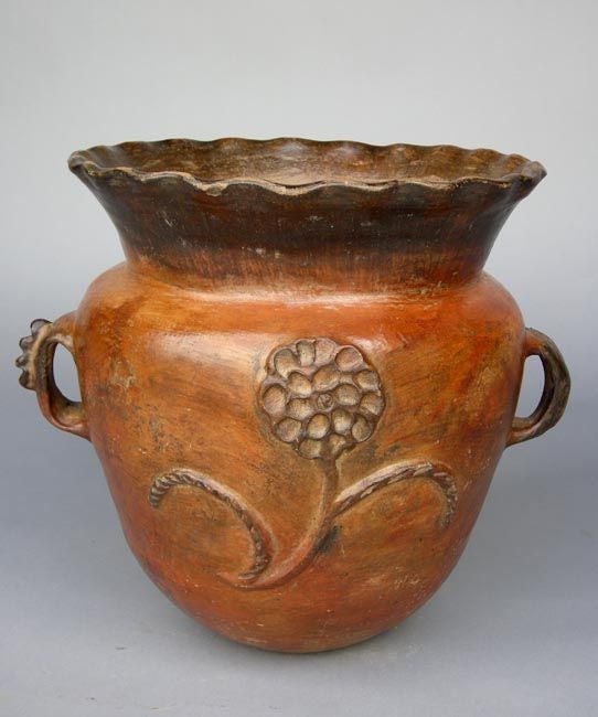 Beautiful 19th c. ceramic florero - water storage vessel,  with raised flower relief. Orange, burnt ochre and brown glaze. Beautiful patina.