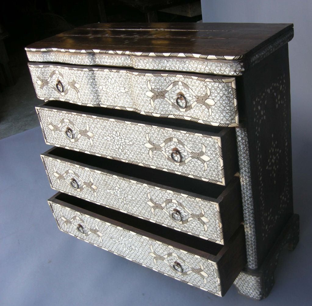 Beautiful bone and mother of pearl inlaid chest of drawers. Both top, front and sides are inlaid