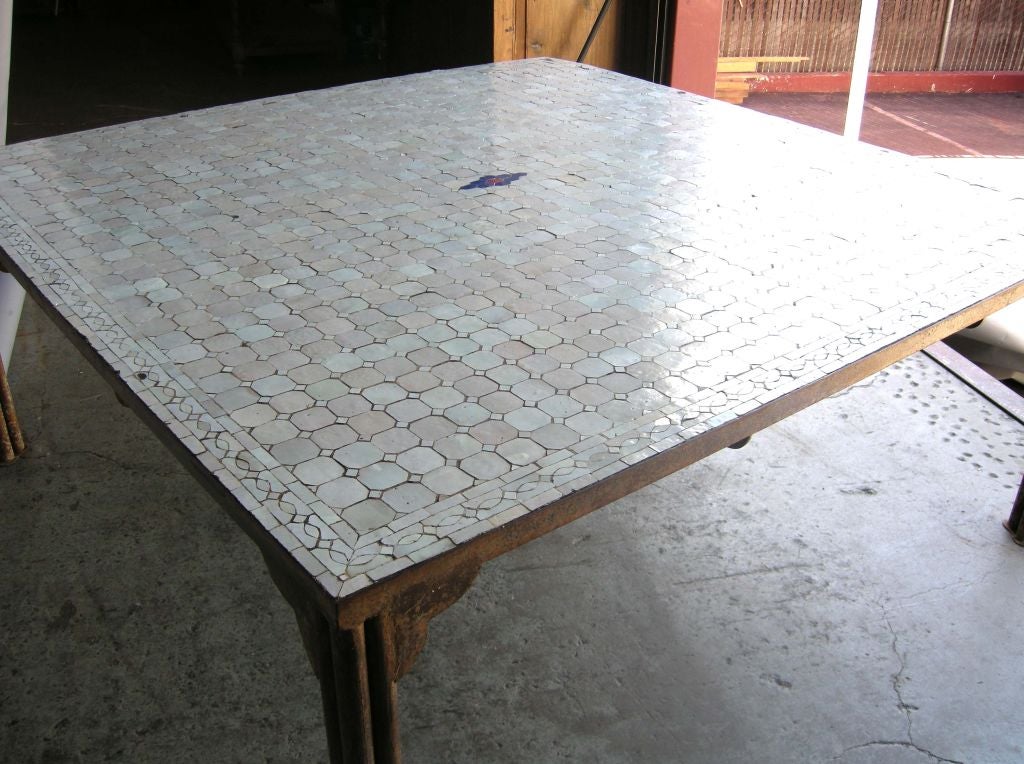 Large Moroccan mosaic table on iron base, tiles are various pearly shades of white (aqua pink, blues and greens)