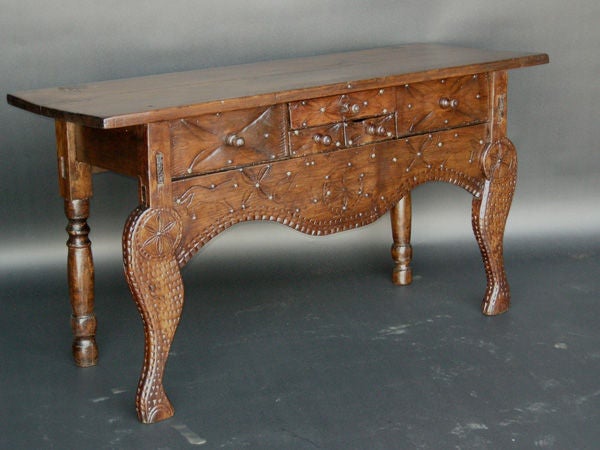 Beautiful example of an early Nahuala (animal spirit) folk art table. It has five drawers with primitive carvings throughout, including claw and ball feet.Beautiful patina and natural wear.