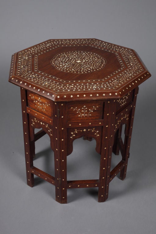 Fine Anglo-Indian inlaid sandalwood Hoshiapur table, the octagonal top with bone inlaid beveled edge, cross banded with bone and metal in a trailing vine, the base with inlaid panels, brackets and legs.
