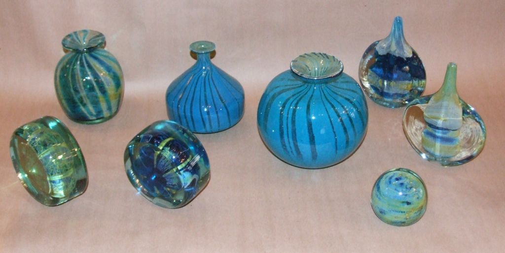 A collection of 8 art glass vessels from the Mdina Glass works, started by Michael Harris in 1968 and managed by him until 1972. These vessels captured, in Harris' mind, the spirit of the Mediterranean with his use of blues, greens and gold