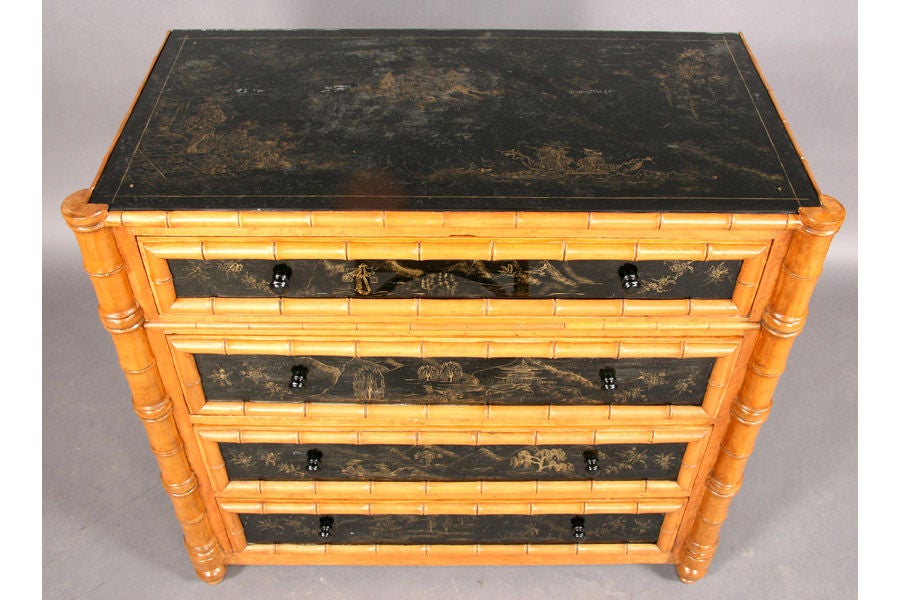 An exceptional faux-bamboo and reverse-painted mirrored chest