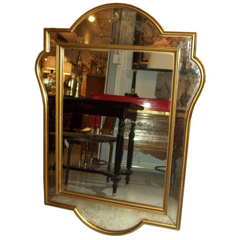 Whimsical French 1940s mirror with giltwood frame.