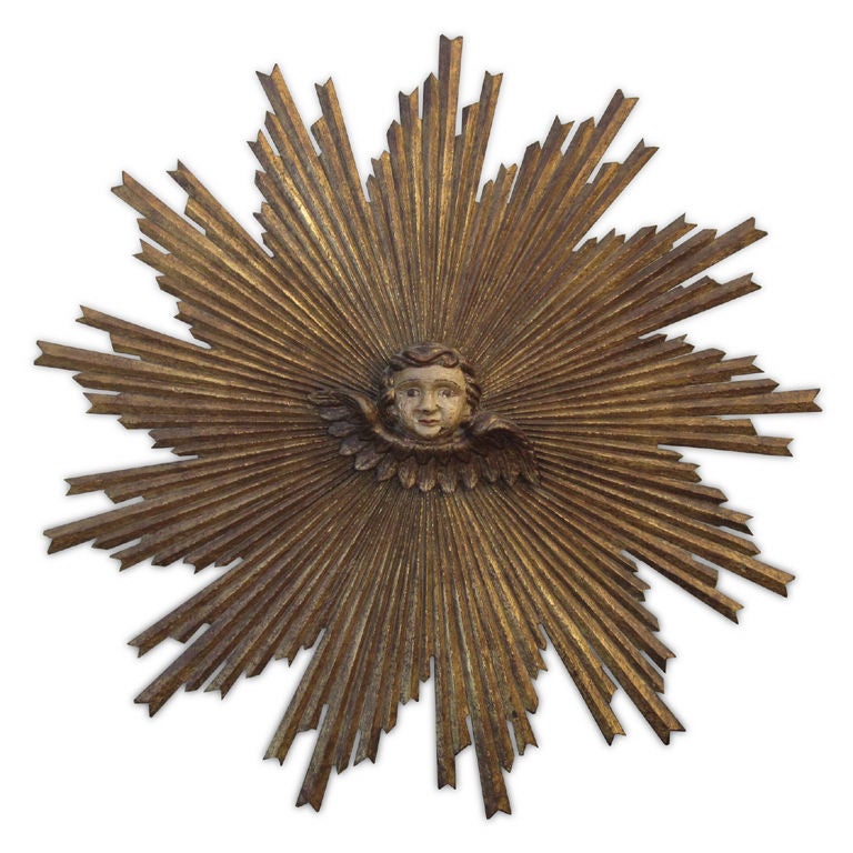 Carved and Gilded Painted Sunburst with Angel Figure