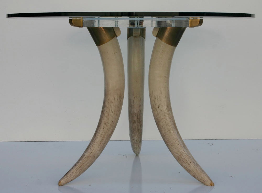 Italian-made custom faux tusk legs with brass hardware and thick lucite mount; 3/4