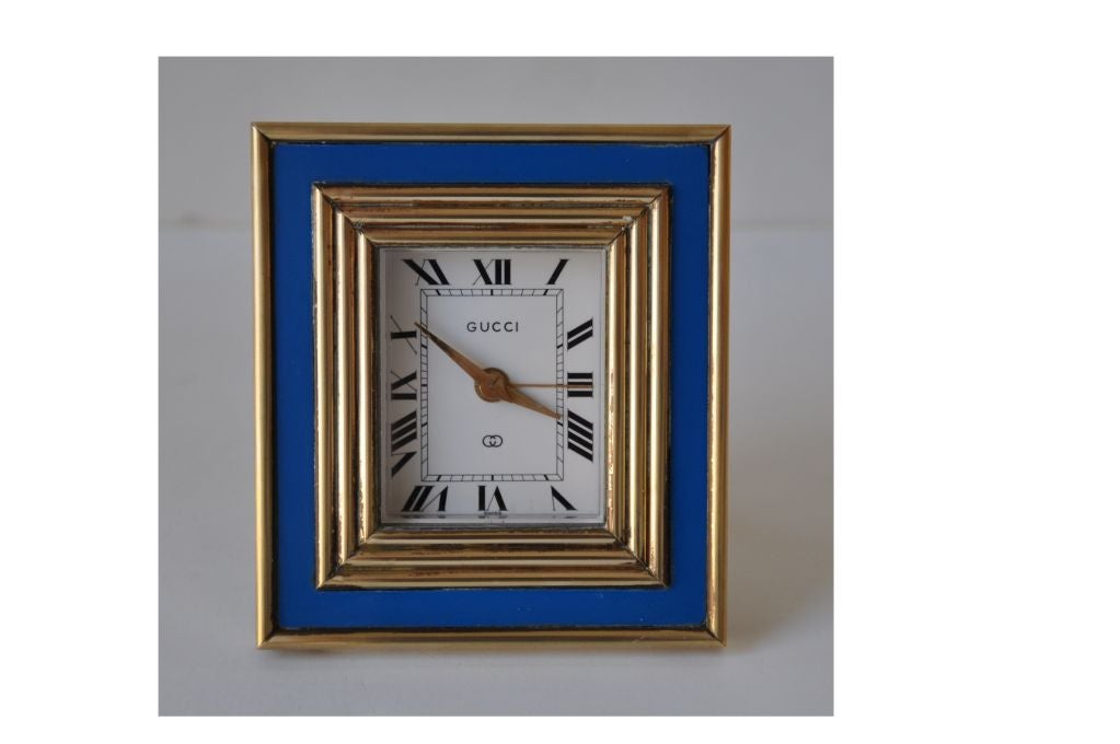 Gucci 8-day alarm clock in blue enamel and brass, made in Switzerland, saphire dial.