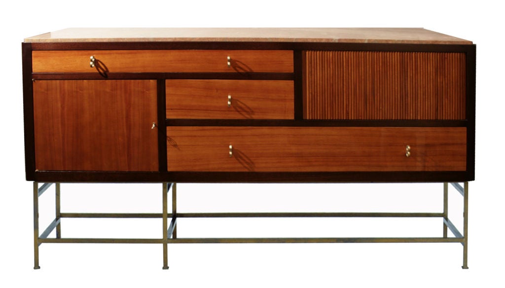 Long sideboard in lacquered and bleached mahogany, with bronze base and drawer pulls and a marble top. Cabinet features three drawers, one tambour door and one door concealing a single shelf. Model 5465 manufactured for Dunbar. Signed with applied
