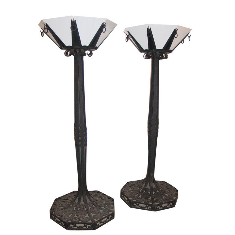 A Pair of Art Deco Style Wrought Iron Torcheres, after E. Brandt For Sale