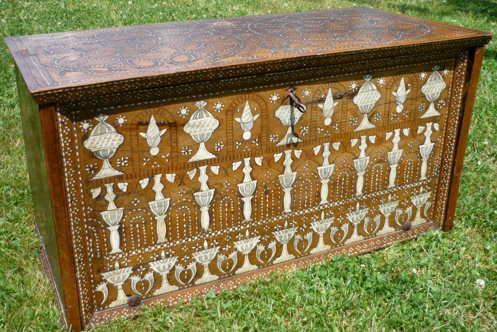 A SPANISH IVORY INLAID WALNUT CASKET, IN THE MUDÉJAR STYLE
16TH/17TH CENTURY
This rare marquetry chest offers a striking example of how the Hispanic decorative arts often combine artistic influences from around the world into compositions of