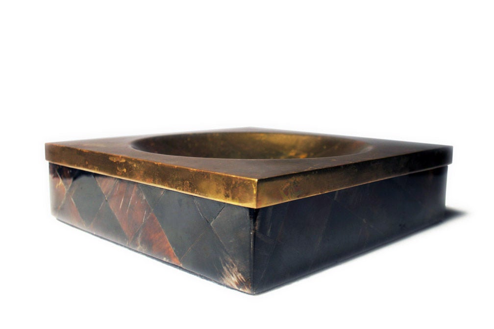 A chic ash tray in a square form with brass tray and box base with a veneer of faux tortoise shell in a diamond pattern.  By Enrique Garces. Colombian, circa 1970.