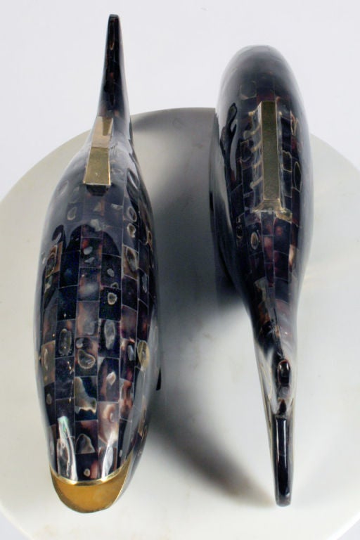 A pair of decorative fish with rainbow shell veneer and brass inlay, each has felt to the underside and one with a maker's label to its underside.  Mod. no. 36-CF. By Maitland-Smith, Ltd. Filipino, circa 1970.