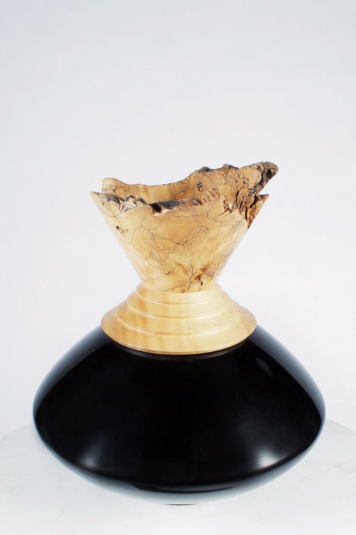 A unique handcrafted wooden vase with a tall free-edge lip in spalted maple, a turned stepped neck supported by a turned black lacquered bulbous body all resting on a circular foot. Johannes Michelsen's work has been exhibited in museums such as the