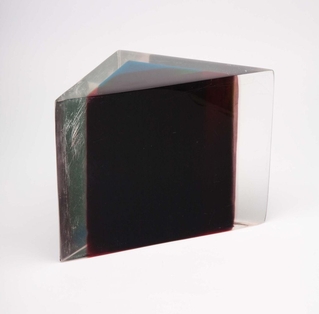 A wonderful triangular acrylic block in layers of clear, green, blue, orange and crimson acrylic that creates a floating effect. By Dennis Byng. U.S.A., circa 1970.