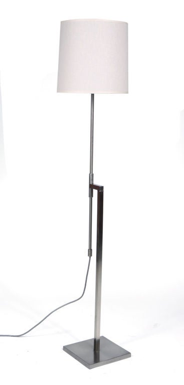 A pair of floor lamps with square tube stem and a round tube pole that adjusts in height (50
