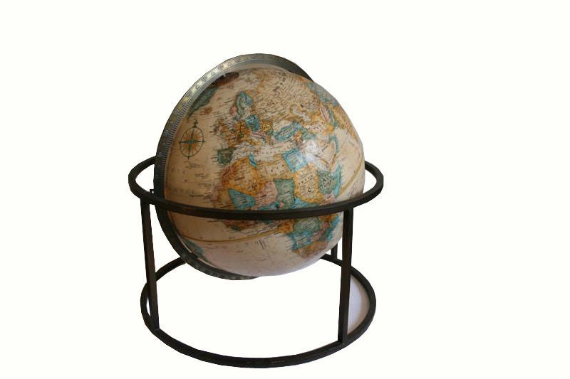 Description: Brass Table-top Terrestrial Globe Ca.1960. Gorgeous rotating globe with full 360 axis pivoting and spinning motion. Globe has raised textured exterior.