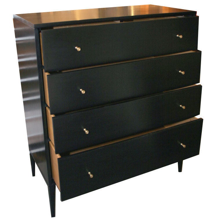 Paul McCobb Planner Group 4-drawer dresser in ebonized maple with brass pulls. 
this item is located at our 1stdibs booth in the New York Design Center at 200 Lexington on the 10th floor booth number 1005.