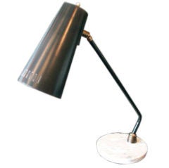 An Adjustable desk Lamp by Stilnovo (signed) An Adjustable desk Lamp by Stilnovo (signed)