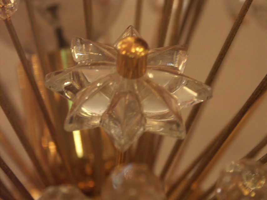 single small flushmount ceiling or wall sconce fixture. Polished brass body with numerous projecting branches, each with a glass fob or star. Three sockets, pefect with chrome tipped bulbs.