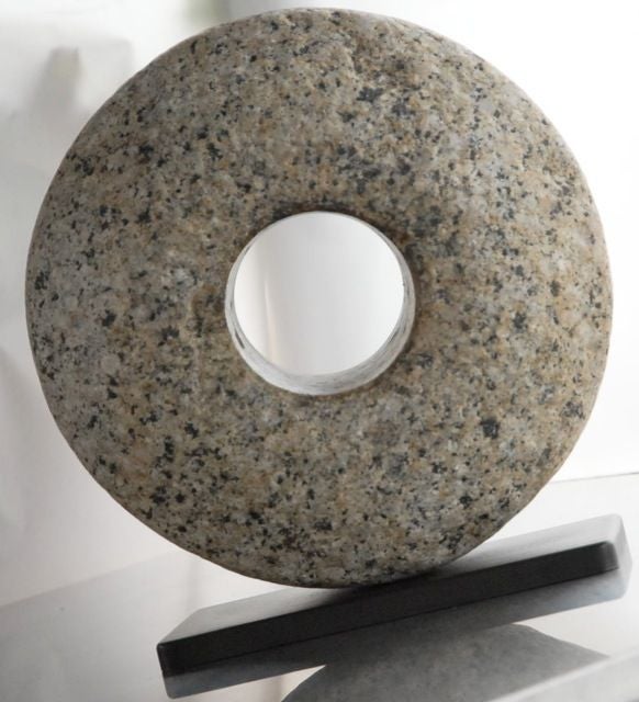 antique granite mill stone on custom made steel base