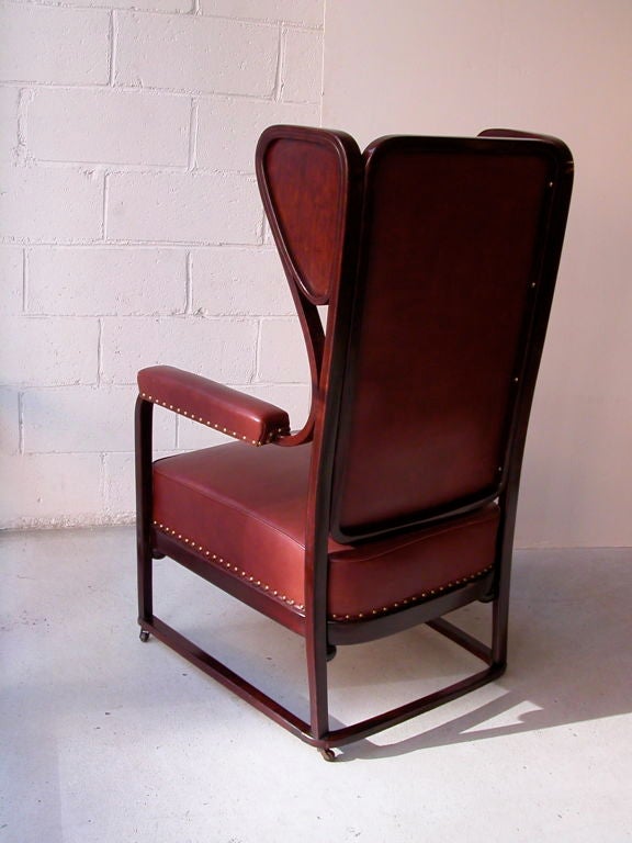Vienna Secession armchair on wheels, model no. 666, in beech wood with leather upholstery designed by Josef Hoffmann, produced by J. & J. Kohn, c. 1903.<br />
2 chairs available.