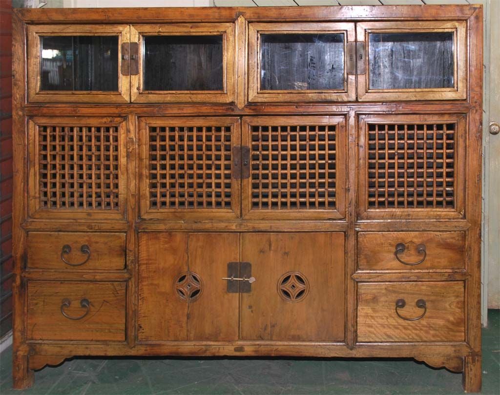 Only piece of furniture needed in a 19th Century upper-class Chinese kitchen.<br />
This combination pantry and hutch, made in beautiful solid elm wood, has eight doors and four drawers. The middle section was probably used to house live poultry!