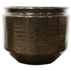 A dark brown multicolored glazed stoneware planter, Earthgender A dark brown multicolored glazed stoneware planter, Earthgender
