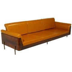 A rosewood, leather and bronze sofa by Jorge Zalszupin