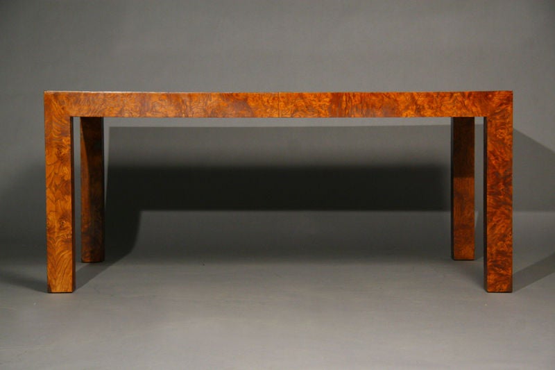 A classic burl dining table by Milo Baughman with two leaves, each 22