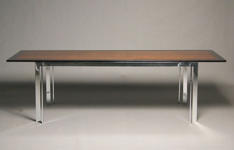 Rosewood dining table on solid steel chromed base