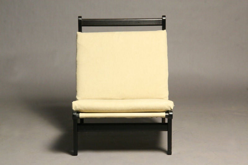 A pair of ebonized high back lounge chairs by Bernt Petersen. Seat depth measures 20