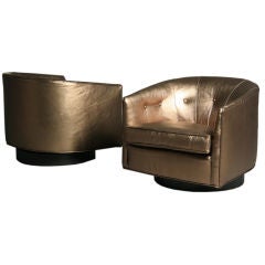 Pair of bronze leather swivel tub chairs by Milo Baughman