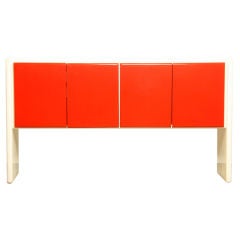 A red-orange and white lacquer credenza Milo Baughman