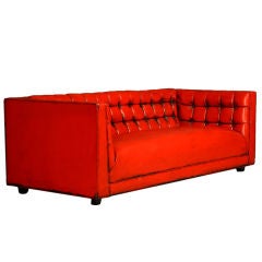 Tufted red leather sofa