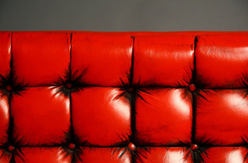 American Tufted red leather sofa