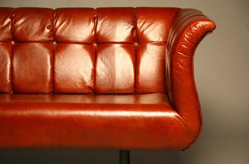 Rare sofa by Harvey Probber in a soft red oxblood leather.  The legs have been ebonized as they were originally.  This sofa is truly beautiful.