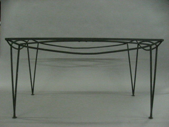 Outdoor dining table in enameled wrought iron by Salterini.