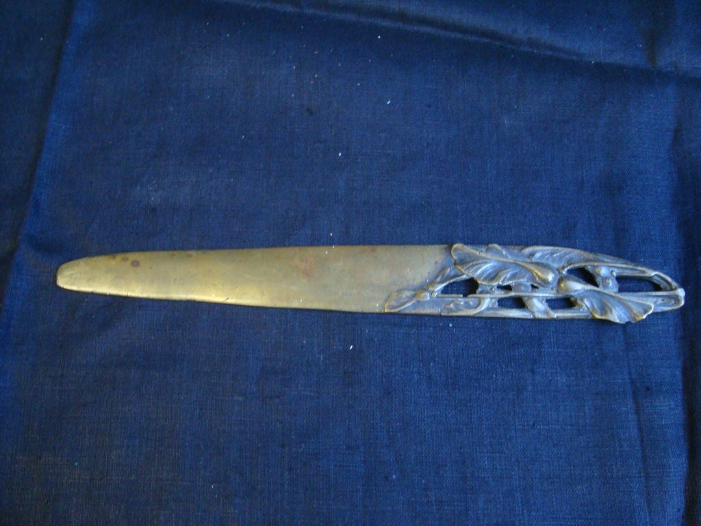 An Art Nouveau bronze letter opener with beautiful carvings.