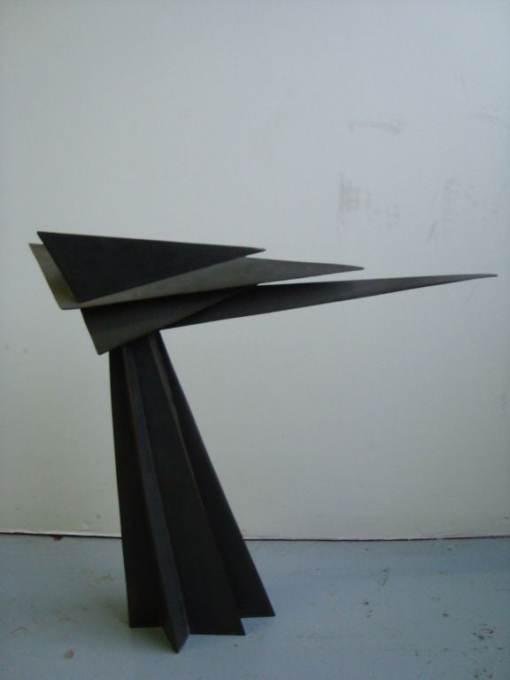 A fine bronze sculpture that evokes motion through its play on triangular forms by listed artist Homer Gunn.

Homer Gunn studied at the Rhode Island School of Design from 1938 to 1941. He taught from 1942 to 1957 and was the sculptor in residence