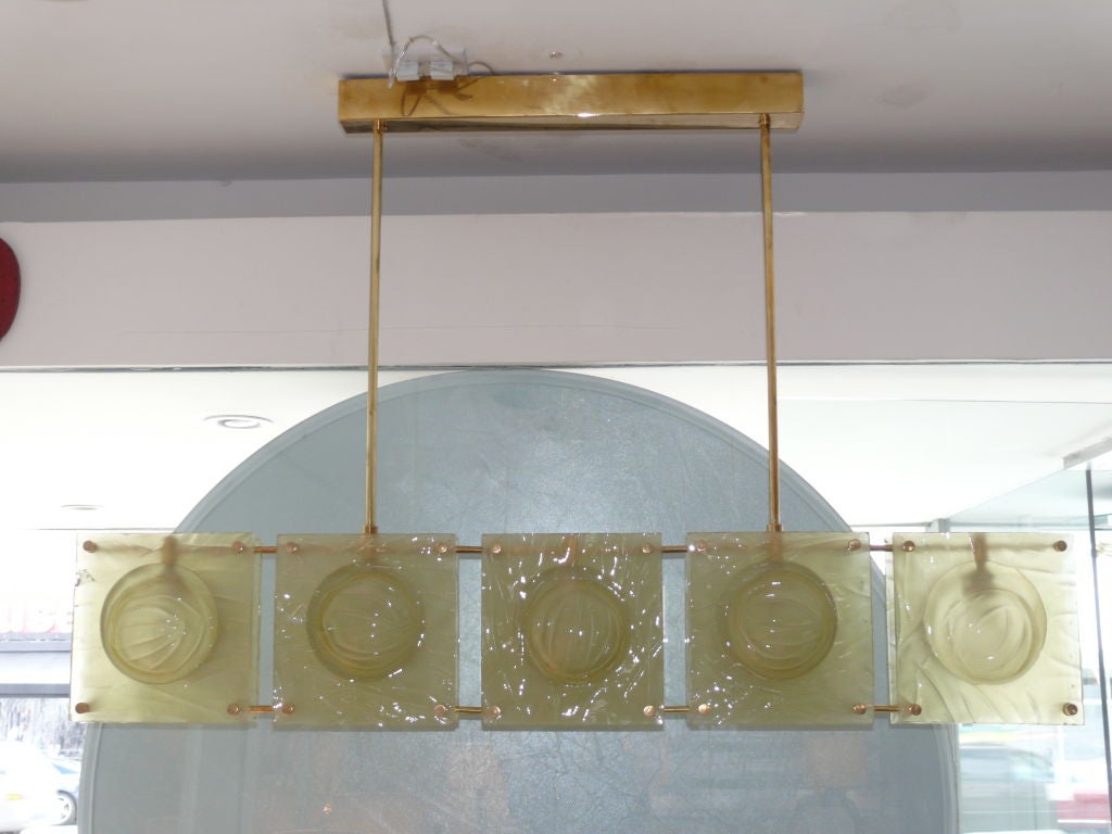 Large scale Italian chandelier Brusotti Murano suspended from 2 brass arms and five convex square amber yellow colored glass. Gorgeous and rare yellow color.
