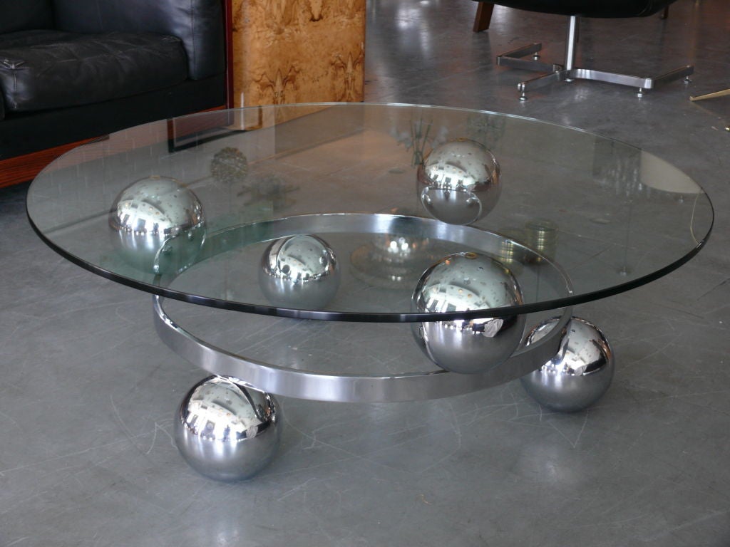 French chrome coffee table with six floating orbs around middle ring.  Floating new glass top.  Great Design!