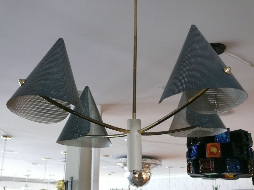 French 4 arm ceiling light with perforated metal cone shades and brass arms. Original black color on outside of cones. Interesting shape and detail. Newly rewired.