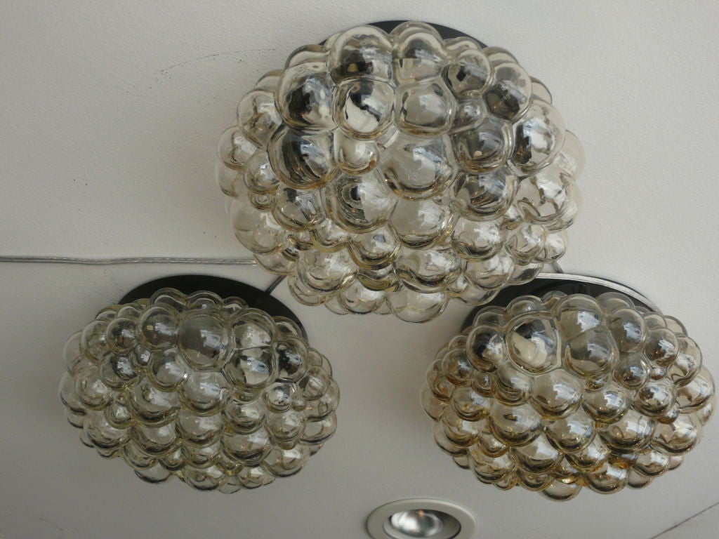 Beautiful bubble glass flushmount ceiling fixtures with oil rub bronze hardware. Thick bubble glass has light amber color tones. Three available and priced individually.<br />
<br />
1 socket 60 watts each