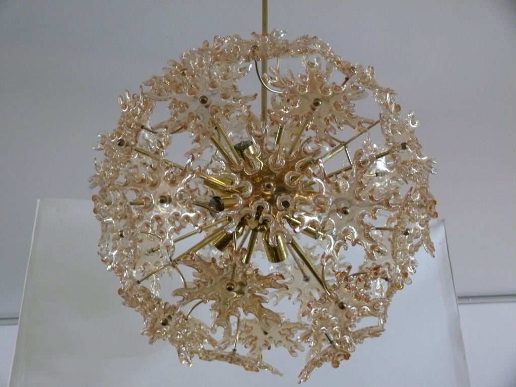 Amazing Italian sputnik ceiling light with amber glass pieces in the shape of snowflakes. Brass arms, stem and canopy and newly rewired.  Absolutely stunning.