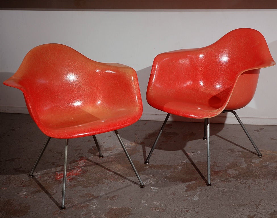 These Eames fibreglass lounge chairs are from the very first year of production, 1950. They are distinguished by their hand-made 